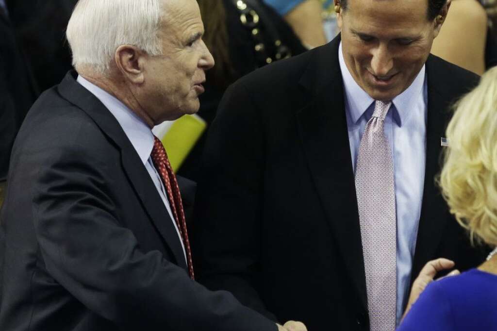 Arizona Senator John McCain, left, shakes hands with former Pennsylvania Sen. Rick Santorum during the Republican National Convention in Tampa, Fla., on Wednesday, Aug. 29, 2012. (AP Photo/Charlie Neibergall)