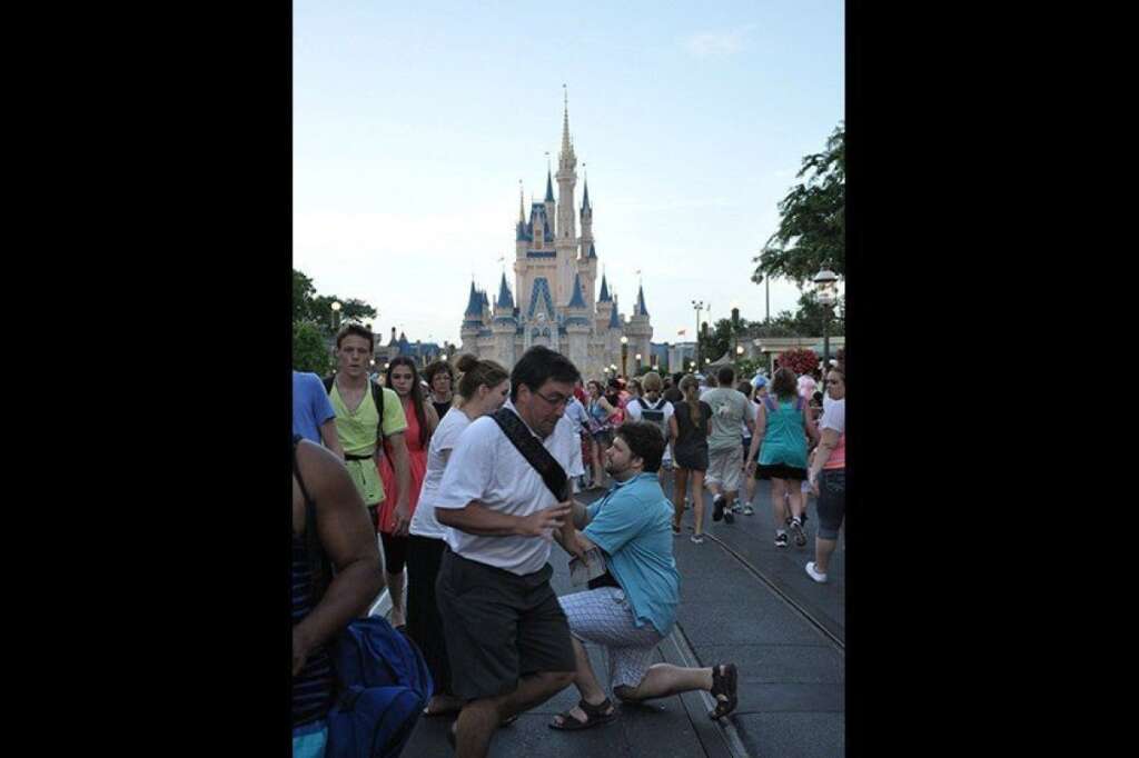 "In The Way" Guy - After this proposal photobomb from Disney World was submitted to Reddit in July 2013, it was such a big hit that viewers nicknamed him "In The Way" Guy, and he became the source of endless Photoshopped memes.  <i>Have a photobomb of your own that you'd like to share? Upload your pic to <a href="https://www.facebook.com/bridalguide" target="_hplink">BG's Facebook page</a> or<a href="http://instagram.com/bridalguide" target="_hplink">submit it to us via Instagram</a> (be sure to include the hashtag #bgphotobombs) and we may add it to our list!</i>  <span style="font-size:10px;"><em>Photo Credit: <a href="http://www.reddit.com/r/pics/comments/1iuztd/tried_to_get_a_photo_of_our_proposalnailed_it/" target="_hplink">SpnkyHappy on Reddit</a></em></span>