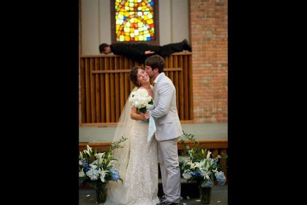 You May Kiss The Bride - It's safe to assume that this planking pastor is on board with the wedding.  <span style="font-size:10px;"><em>Photo Credit: <a href="http://imgur.com/MIRyv" target="_hplink">awhiteghost on Imgur</a></em></span>