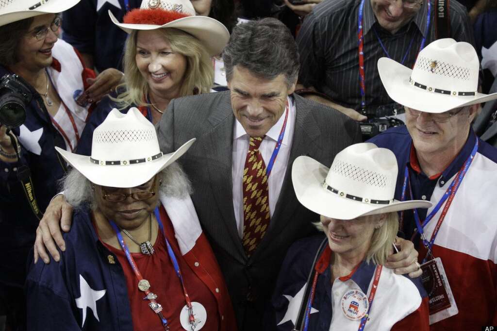 Texas Governor Rick Perry poses with delegates during the Republican National Convention in Tampa, Fla., on Tuesday, Aug. 28, 2012. (AP Photo/Charlie Neibergall)