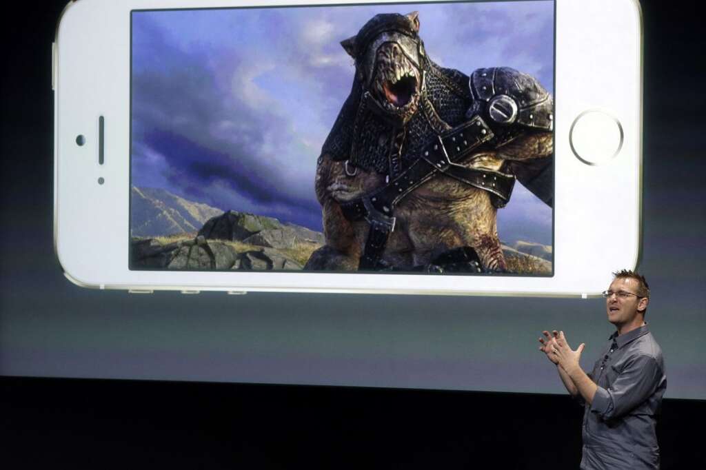 Keynote Apple - Donald Mustard, CEO of Epic Games, speaks on stage during the introduction of the new iPhone 5s in Cupertino, Calif., Tuesday, Sept. 10, 2013. (AP Photo/Marcio Jose Sanchez)