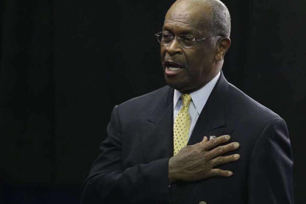 Herman Cain recites the Pledge of Allegiance during the Republican National Convention in Tampa, Fla., on Thursday, Aug. 30, 2012. (AP Photo/Charlie Neibergall)