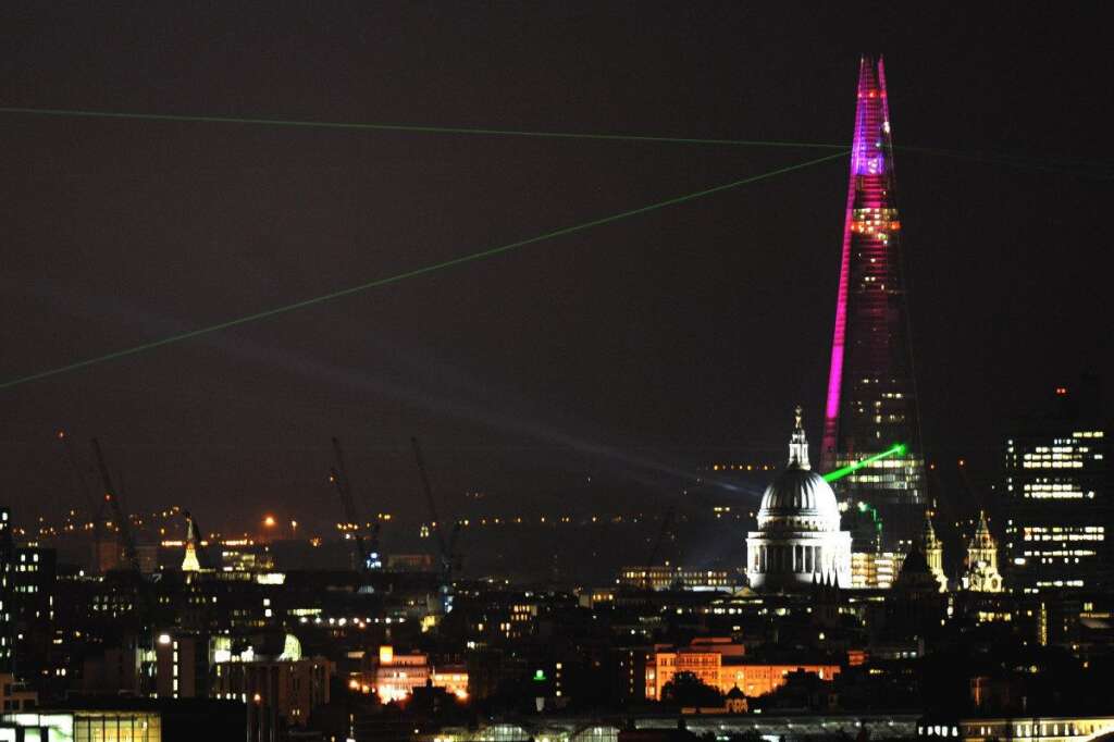Shard opened - A laser show projected from the Shard skyscraper on the South Bank, London, seen from Parliament Hill, marking the completion of the exterior of the building, with work on the inside expected to continue into 2013 and following the official inauguration of the skyscraper earlier today.