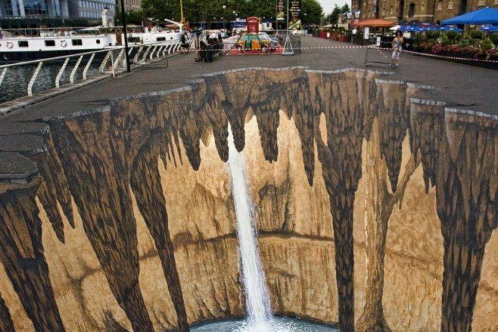 - Known for his impressive 3D pavement art, Edgar Mueller created this gigantic chasm for the West India Quay Festival in London. Mueller derives some of his <a href="http://www.nowpublic.com/culture/edgar-mueller-ice-age-3d-pavement-art-guiness-world-record" target="_hplink">inspiration from the "Ice Age" films</a>.    (<a href="http://www.flickr.com/photos/stumayhew/3660737236/" target="_hplink">Image via Flickr</a>)