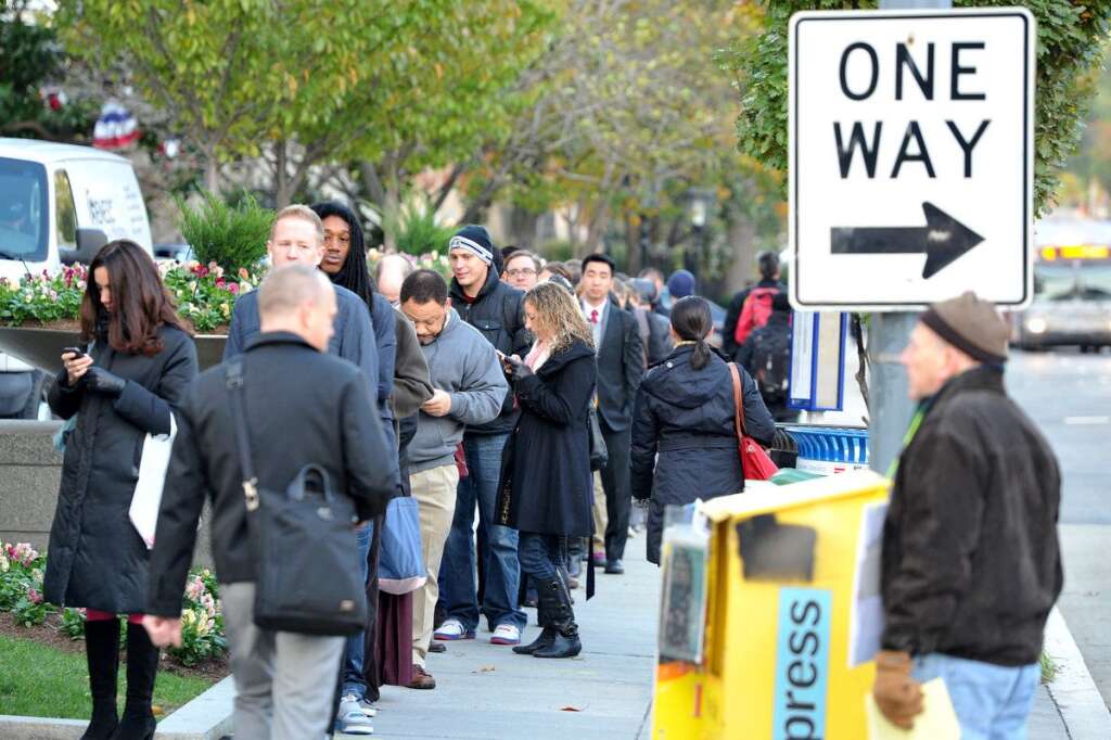 US-VOTE-2012-ELECTION - Voters wait outside the polling station to cast their ballots at Metropolitan AME Church  in Washington, DC on November 6, 2012. Americans headed to the polls Tuesday after a burst of last-minute campaigning by President Barack Obama and Mitt Romney in a nail-biting contest unlikely to heal a deeply polarized nation. AFP PHOTO/Mladen ANTONOV        (Photo credit should read MLADEN ANTONOV/AFP/Getty Images)