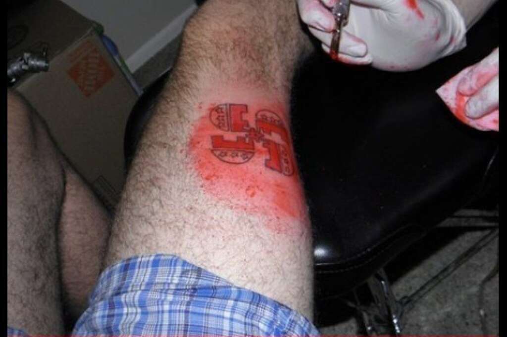 GOP Swastika - Remember now, they're permanent.    <em><a href="http://ugliesttattoos.failblog.org/2012/04/10/funny-tattoos-gopstika/" target="_hplink">(Ugliest Tattoos)</a></em>