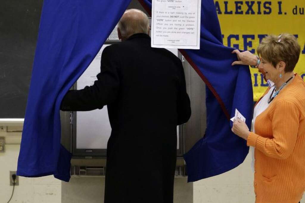 Joe Biden - Vice President Joe Biden steps into a voting booth to cast his ballot at Alexis I. duPont High School, Tuesday, Nov. 6, 2012, in Greenville, Del. (AP Photo/Matt Rourke)