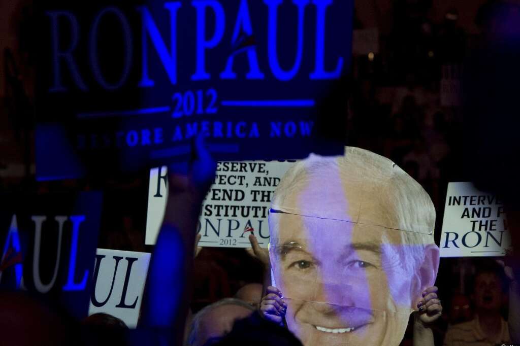 US-VOTE-2012-REPUBLICAN CONVENTION - Supporters wave banners and a portret of US Republican presidential contender Ron Paul during a rally at the Sun Dome of the University of South Florida in Tampa, Florida, on August 26, 2012. Thousands of Ron Paul supporters gathered in Sun Dome to show support for their candidate.    AFP PHOTO/MLADEN ANTONOV        (Photo credit should read MLADEN ANTONOV/AFP/GettyImages)