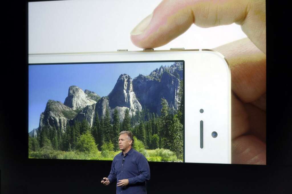 - Phil Schiller, Apple's senior vice president of worldwide product marketing, speaks on stage about the camera quality during the introduction of the new iPhone 5s in Cupertino, Calif., Tuesday, Sept. 10, 2013. Apples latest iPhones will come in a bevy of colors and two distinct designs, one made of plastic and the other that aims to be the gold standard of smartphones and reads your fingerprint. (AP Photo/Marcio Jose Sanchez)
