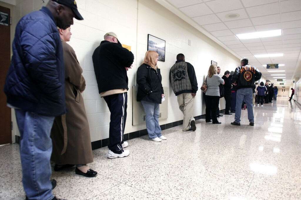 U.S. Citizens Head To The Polls To Vote In Presidential Election - STERLING HEIGHTS, MI, - NOVEMBER 6: U.S. citizens line up to vote in the presidential election at Carleton Middle School November 6, 2012 in Sterling Heights, Michigan. Recent polls show that U.S. President Barack Obama and Republican presidential candidate Mitt Romney are in a tight race. (Photo by Bill Pugliano/Getty Images)