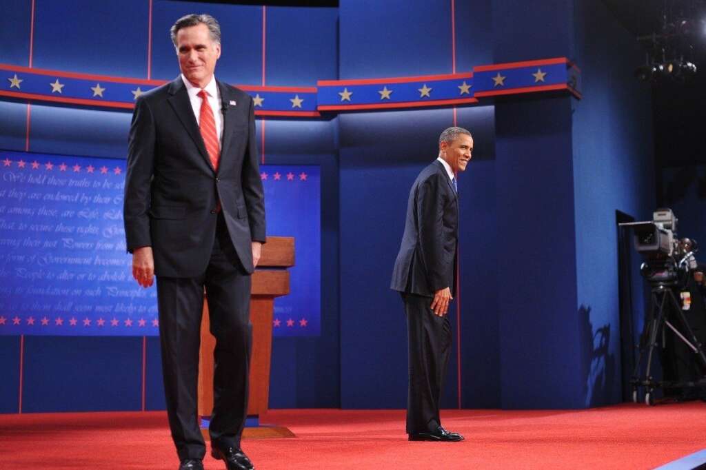 US-VOTE-2012-DEBATE - US President Barack Obama and Republican presidential candidate Mitt Romney make their way to their lecterns October 3, 2012 after shaking hands for the first presidential debate at the University of Denver in Denver, Colorado. AFP PHOTO/Mandel NGAN        (Photo credit should read MANDEL NGAN/AFP/GettyImages)