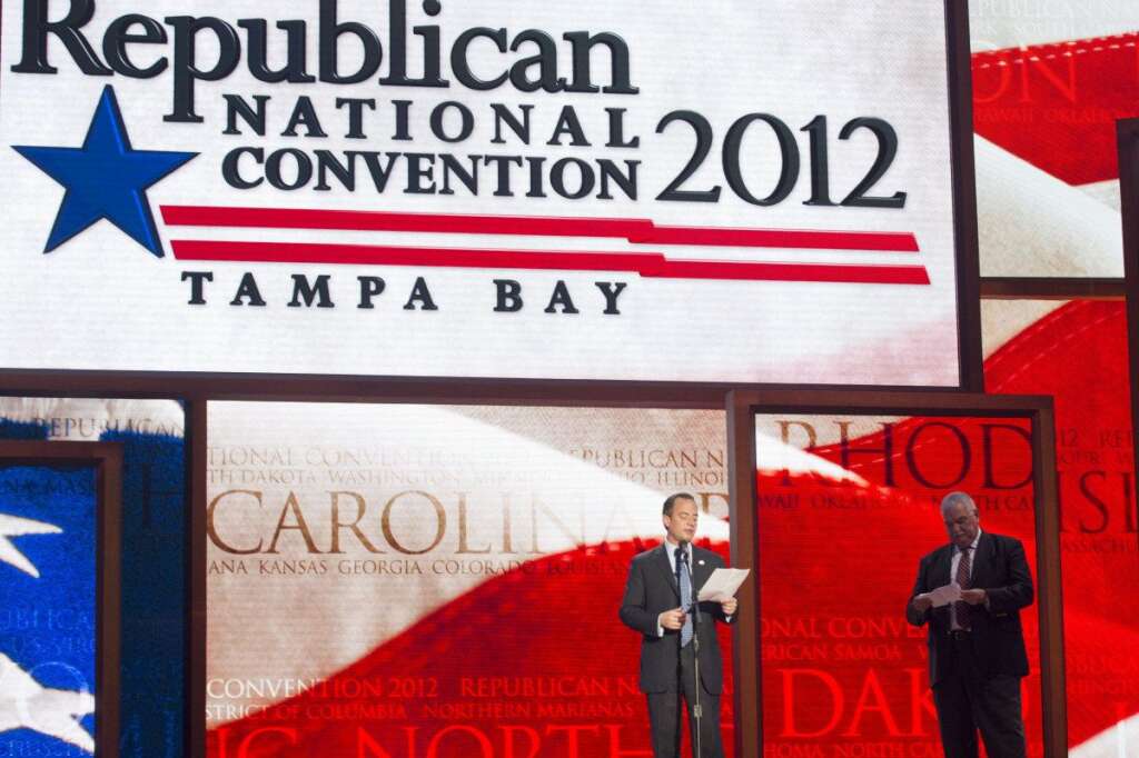 Reince Priebus, Willan Harris - Republican National Committee Chairman Reince Priebus, left, and convention CEO William Harris unveil the stage and podium for the 2012 Republican National Convention, Monday, Aug. 20, 2012, at the Tampa Bay Times Forum in Tampa, Fla. (AP Photo/Scott Iskowitz)