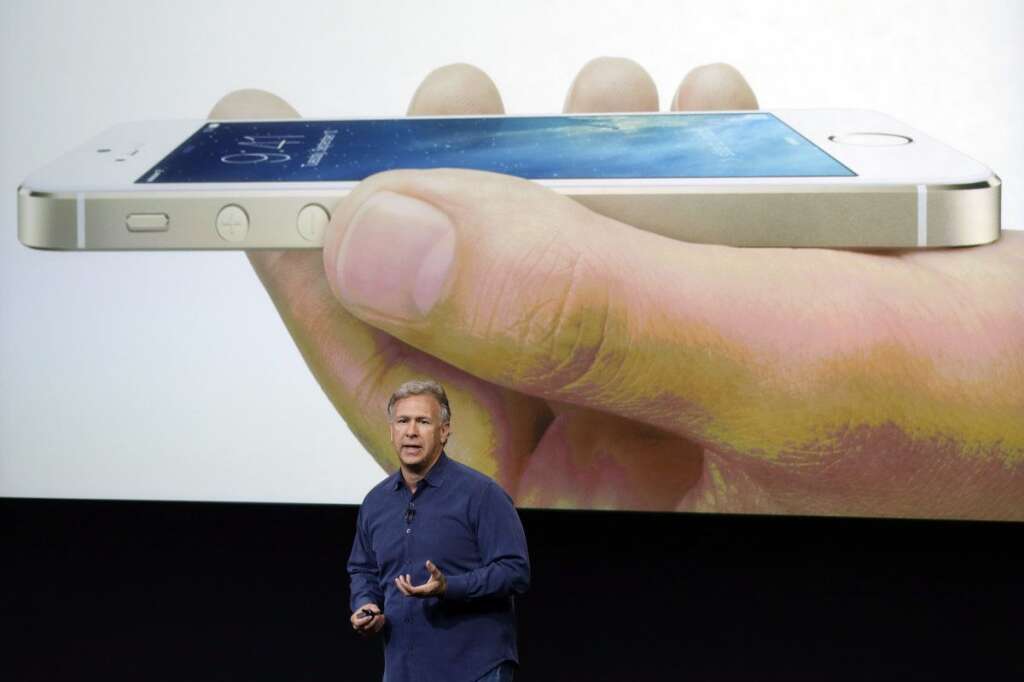 - Phil Schiller, Apple's senior vice president of worldwide product marketing, speaks on stage during the introduction of the new iPhone 5s in Cupertino, Calif., Tuesday, Sept. 10, 2013. Apples latest iPhones will come in a bevy of colors and two distinct designs, one made of plastic and the other that aims to be the gold standard of smartphones and reads your fingerprint. (AP Photo/Marcio Jose Sanchez)