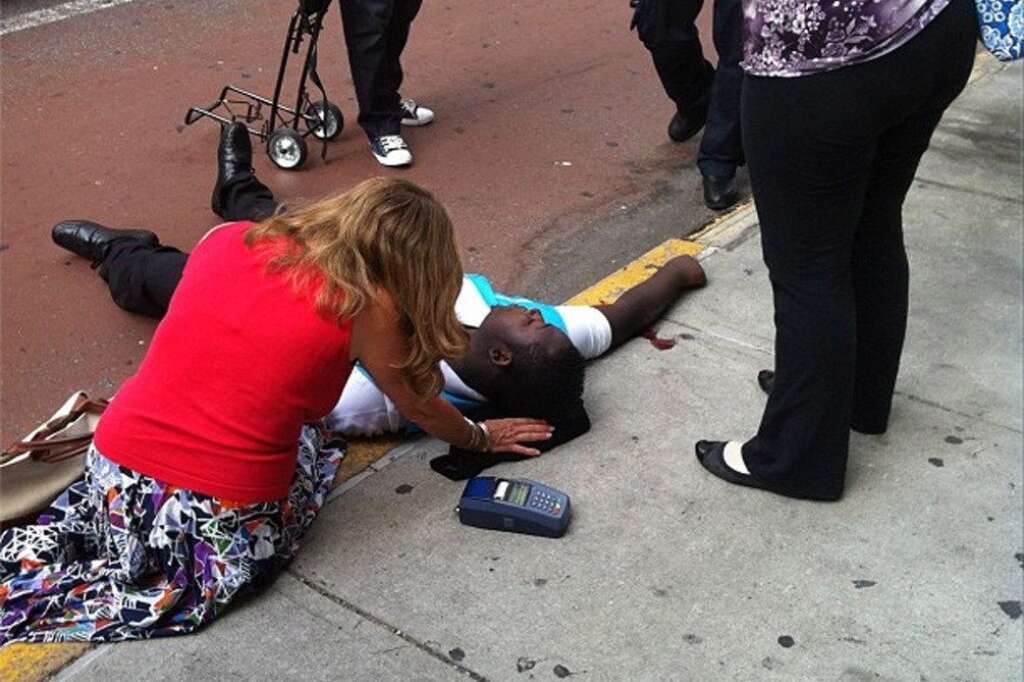 - This photo posted to an Instagram account belonging to a person identified as mr_mookie, an eyewitness at the scene, shows a victim of a shooting being tended to by pedestrians outside the Empire State Building in New York, Friday, Aug. 24, 2012. The identity or condition of the victim was not immediately known. Law enforcement officials in New York City say at least four people have been shot outside the Empire State Building in violence that stemmed from a workplace dispute, and that the gunman has been killed by police. The shooting happened at about 9 a.m. Friday at 34th Street and Fifth Avenue. (AP Photo/mr_mookie via Instagram)