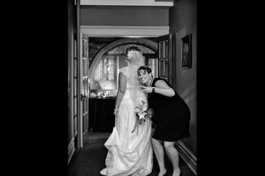 Walk The Walk - That moment before you walk down the aisle can be nerve-wracking; this bridesmaid found a way to lighten up the mood.  <i>Have a photobomb of your own that you'd like to share? Upload your pic to <a href="https://www.facebook.com/bridalguide" target="_hplink">BG's Facebook page</a> or<a href="http://instagram.com/bridalguide" target="_hplink">submit it to us via Instagram</a> (be sure to include the hashtag #bgphotobombs) and we may add it to our list!</i>  <span style="font-size:10px;"><em>Photo Credit: <a href="http://www.crystalmadsen.com" target="_hplink">Crystal Madsen Photography</a></em></span>