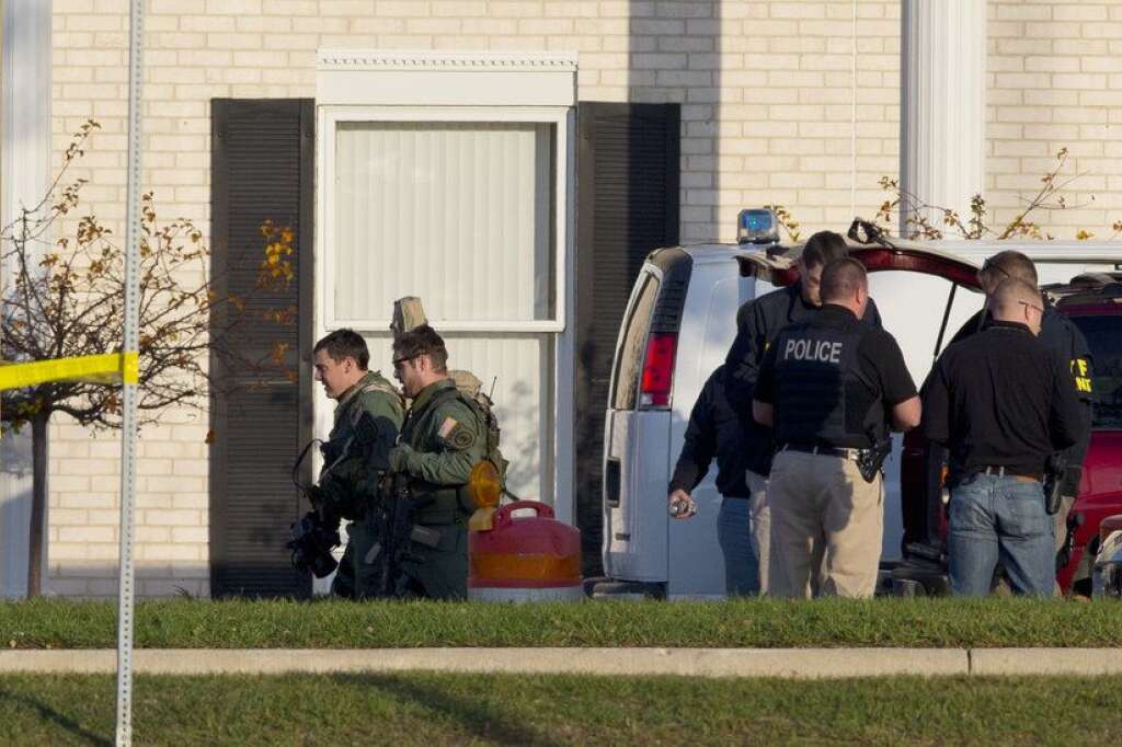 Three People Killed During Shooting At Spa Outside Of Milwaukee - BROOKFIELD, WI - OCTOBER 21:  Police personnel work near the Azana Salon and Spa where three people were killed and four others wounded after a mass shooting on October 21, 2012 in Brookfield, Wisconsin. The suspected shooter, Radcliffe Haughton, was found dead inside the spa. (Photo by Jeffrey Phelps/Getty Images)