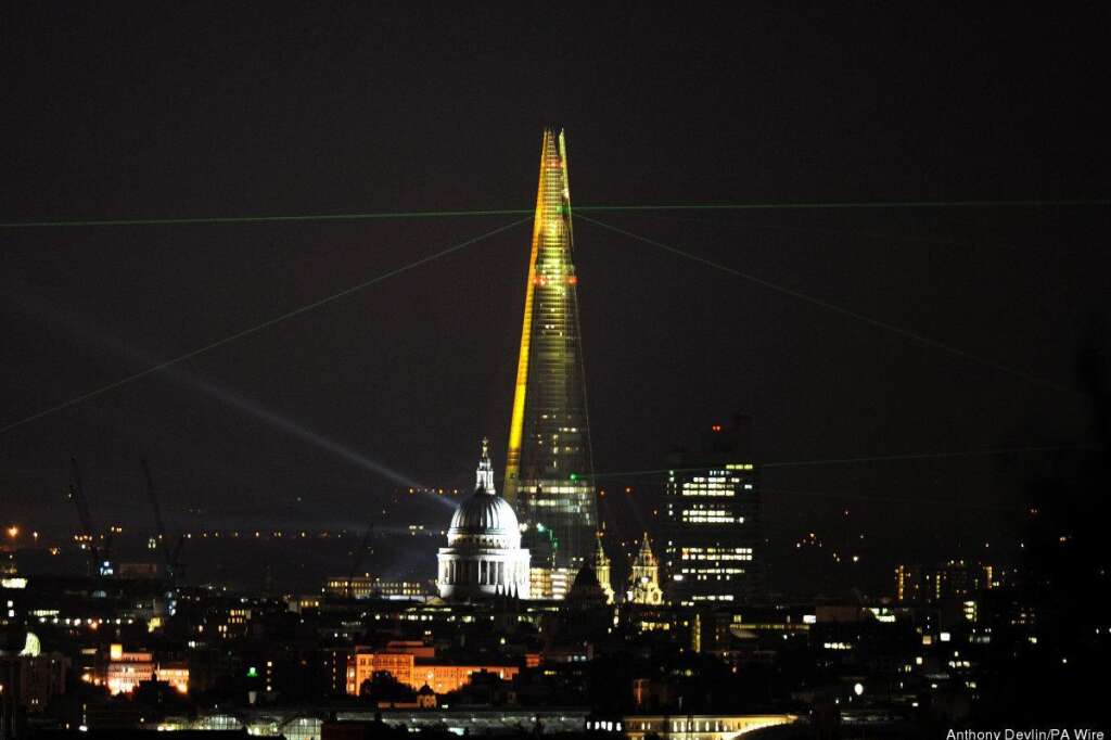 Shard opened - A laser show projected from the Shard skyscraper on the South Bank, London, seen from Parliament Hill, marking the completion of the exterior of the building, with work on the inside expected to continue into 2013 and following the official inauguration of the skyscraper earlier today.