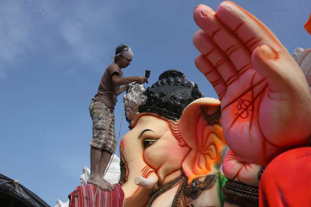 - An Indian artist provides final touches to an idol of the elephant headed Hindu god Ganesha before it is carried off for worship to mark Ganesh Chaturthi festival, in Hyderabad, India, Monday, Sept. 5, 2016. The idol will be immersed in water bodies after worship at the end of the festival.