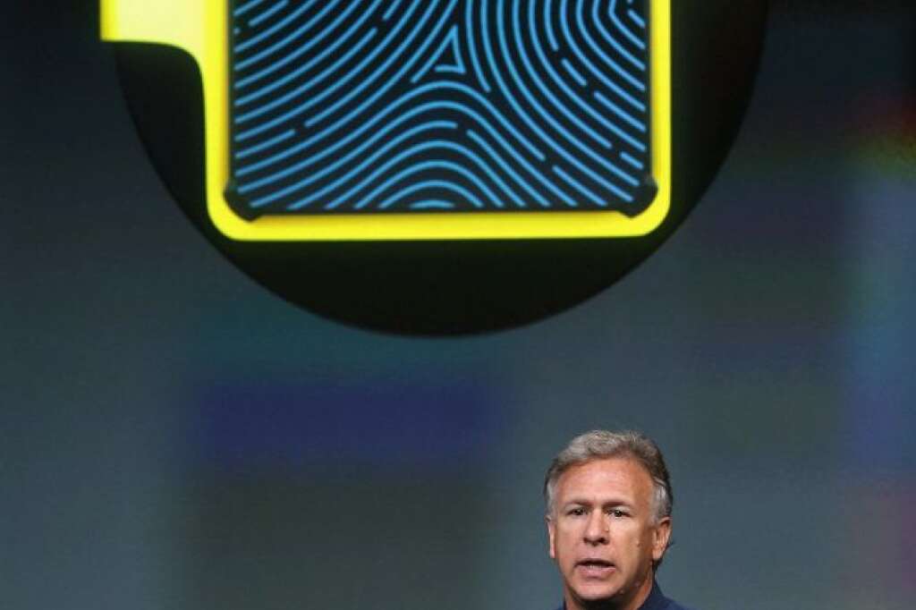Keynote Apple - CUPERTINO, CA - SEPTEMBER 10:  Apple Senior Vice President of Worldwide Marketing Phil Schiller speaks about security features of the new iPhone 5S during an Apple product announcement at the Apple campus on September 10, 2013 in Cupertino, California. The company launched two new iPhone models that will run iOS 7. The 5C is made from a hard-coated polycarbonate and comes in five colors. The 5S features a fingerprint sensor, has an upgraded camera, and contains an A7 chip  (Photo by Justin Sullivan/Getty Images)