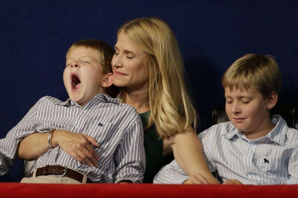 Sam Ryan yawns in his mother's arms while Janna listen to her husband Republican vice presidential nominee, Rep. Paul Ryan's speech during the Republican National Convention in Tampa, Fla., on Wednesday, Aug. 29, 2012. Right is Charlie Ryan. (AP Photo/Charlie Neibergall)