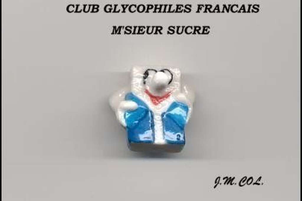 Pour les collectionneurs de fèves - Cette fève a été réalisée en l'honneur du <a href="http://www.clubdesglycophilesfrancais.eu/" target="_blank">club glycophiles français</a>, des collectionneurs d'emballages de sucre.