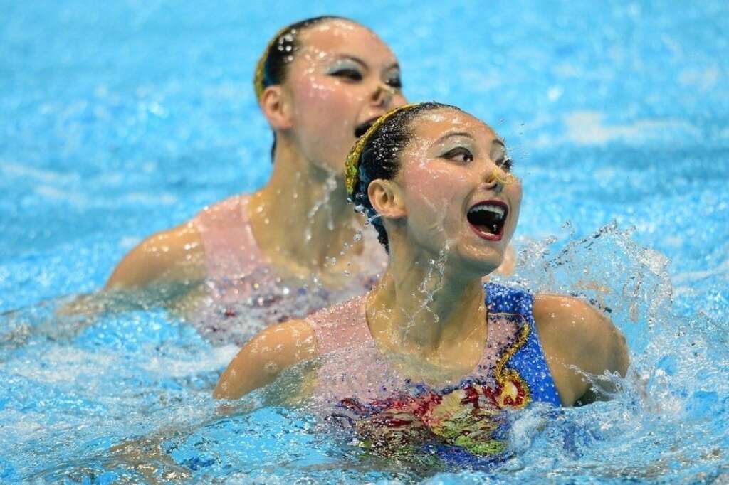Les visages de la nage synchronisée - Les Chinoises Liu Ou et Huang Xuechen  (MARTIN BUREAU / Getty Images)