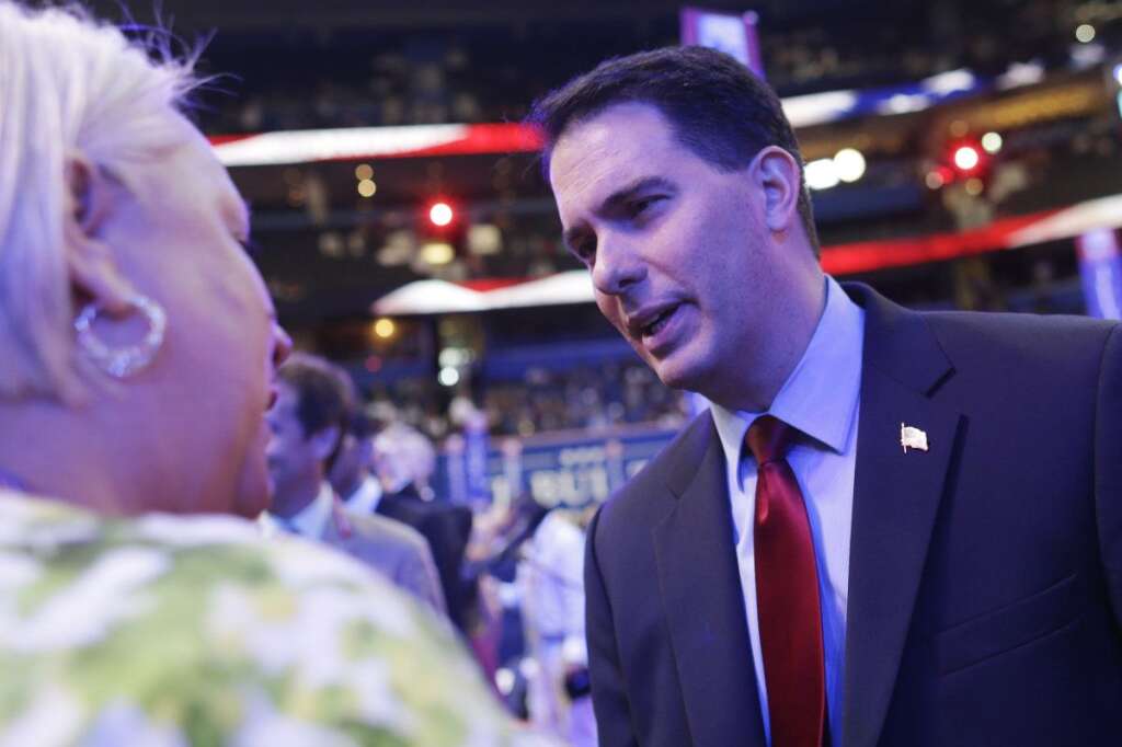 Scott Walker - Wisconsin Gov. Scott Walker talks to delegates on the floor at the Republican National Convention in Tampa, Fla., on Tuesday, Aug. 28, 2012. (AP Photo/Charles Dharapak)