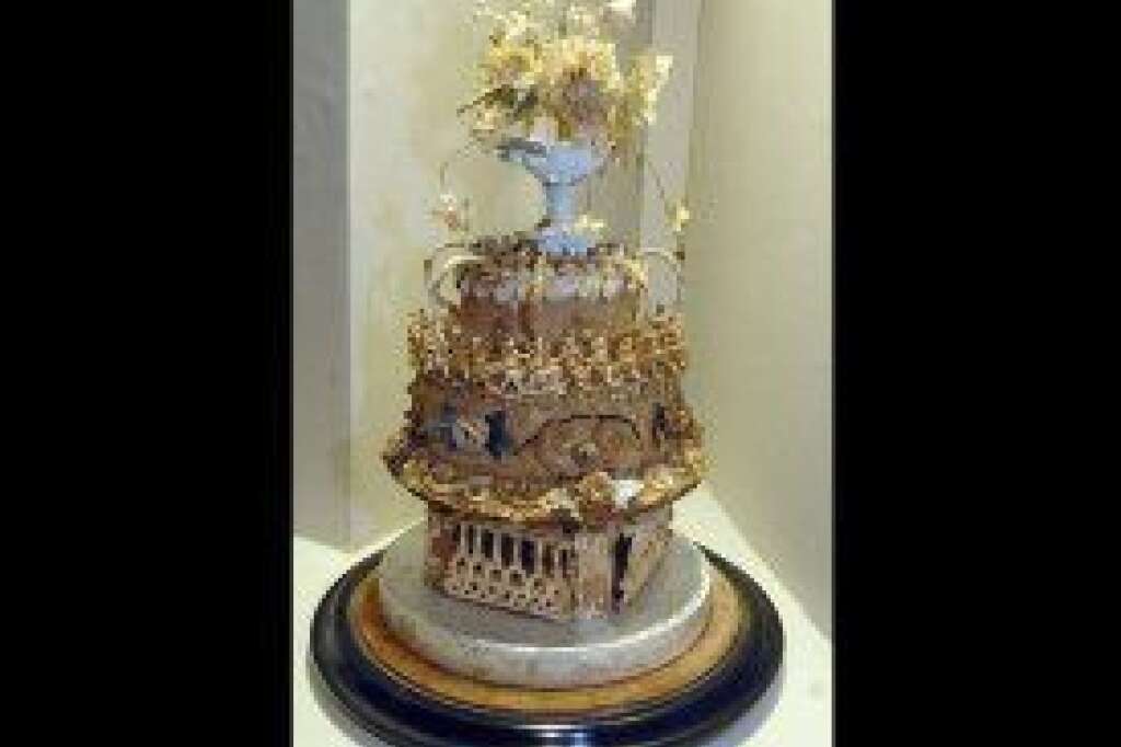 World's Oldest Cake - Most people throw out their leftovers after a few days -- or at most a few weeks. But a museum in England is displaying a 113-year-old wedding cake that's being called the world's oldest. The Willis Museum in Basingstoke, Hampshire, says the delicately decorated Victorian cake was baked in 1898. The confection has browned over the years and suffered a crack after a World War II bomb blast, but it has survived for more than a century, first in a baker's window and then in storage, before being donated to the museum. A recent investigation with a syringe revealed that the fruitcake inside is still moist.