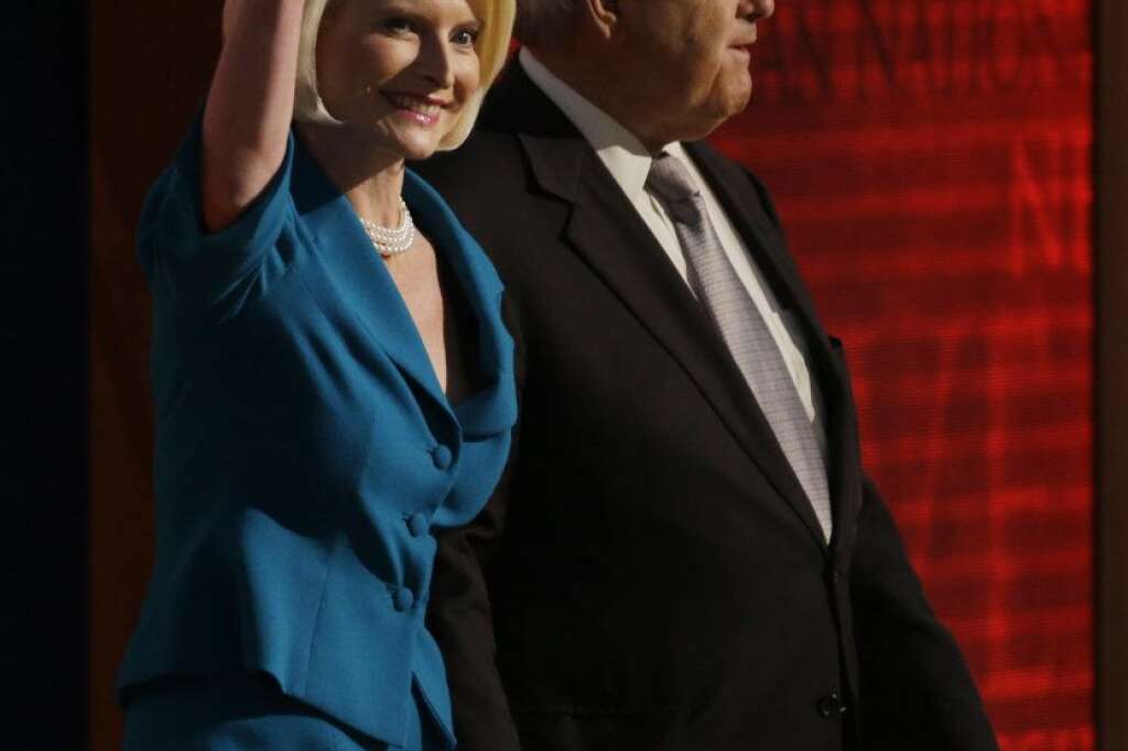 Former House Speaker Newt Gingrich and his wife Callista walk onto the stage to speak to delegates during the Republican National Convention in Tampa, Fla., on Thursday, Aug. 30, 2012. (AP Photo/Charlie Neibergall)