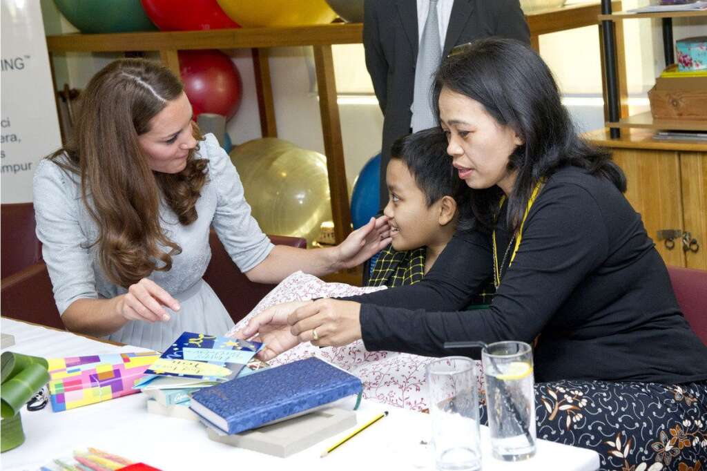 The Duke And Duchess Of Cambridge Tour Southeast Asia - Day 3 - KUALA LUMPUR, MALAYSIA - SEPTEMBER 13:  Catherine, Duchess of Cambridge meets leukemia sufferer Zakwan Anuar, 15, at Hospis Malaysia on Day 3 of Prince William, Duke of Cambridge and Catherine, Duchess of Cambridge's Diamond Jubilee Tour of South East Asia on September 13, 2012 in in Kuala Lumpur, Malaysia.  Prince William, Duke of Cambridge and Catherine, Duchess of Cambridge are on a Diamond Jubilee Tour of South East Asia and the South Pacific taking in Singapore, Malaysia, Solomon Islands and Tuvalu. (Photo by Arthur Edwards - Pool/Getty Images)