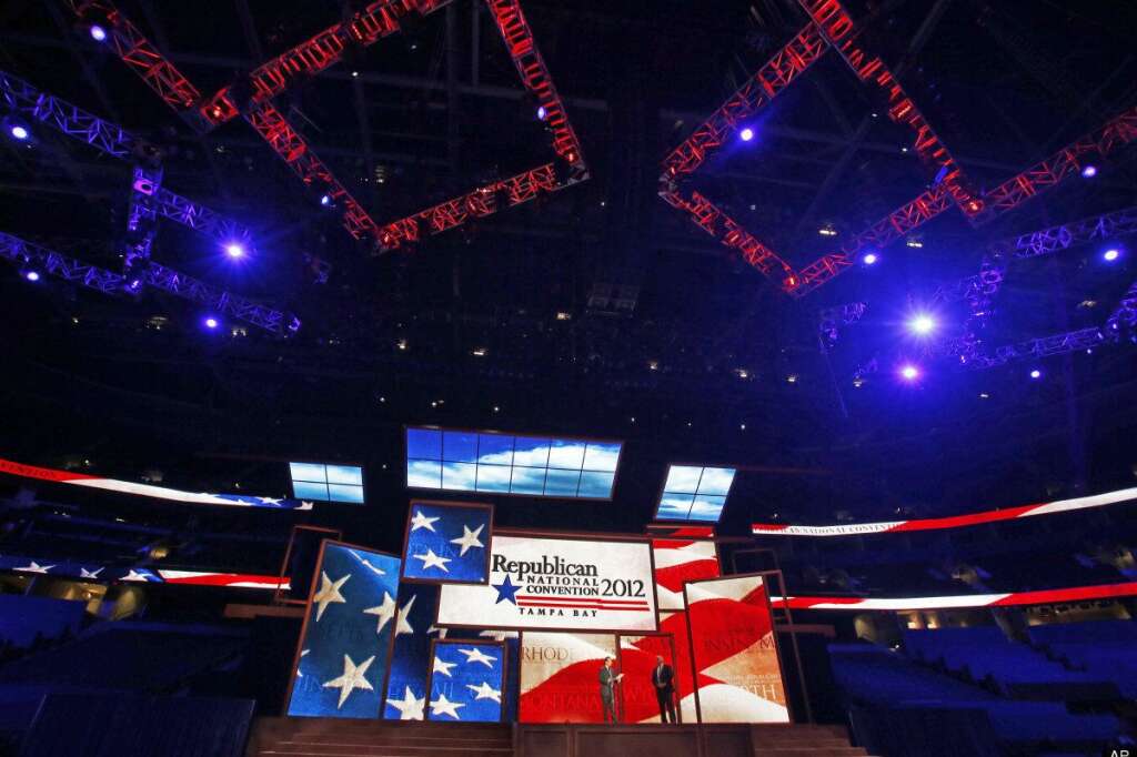Reince Priebus, Willan Harris - Republican National Committee Chairman Reince Priebus, left, and convention CEO William Harris unveil the stage and podium for the 2012 Republican National Convention, Monday, Aug. 20, 2012, at the Tampa Bay Times Forum in Tampa, Fla. (AP Photo/Scott Iskowitz)
