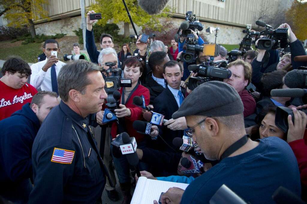 Three People Killed During Shooting At Spa Outside Of Milwaukee - BROOKFIELD, WI - OCTOBER 21:  Brookfield Chief of Police Daniel Tushaus (L) speaks to the media near the Azana Salon and Spa where three people were killed and four others wounded after a mass shooting on October 21, 2012 in Brookfield, Wisconsin. The suspected shooter, Radcliffe Haughton, was found dead inside the spa. (Photo by Jeffrey Phelps/Getty Images)