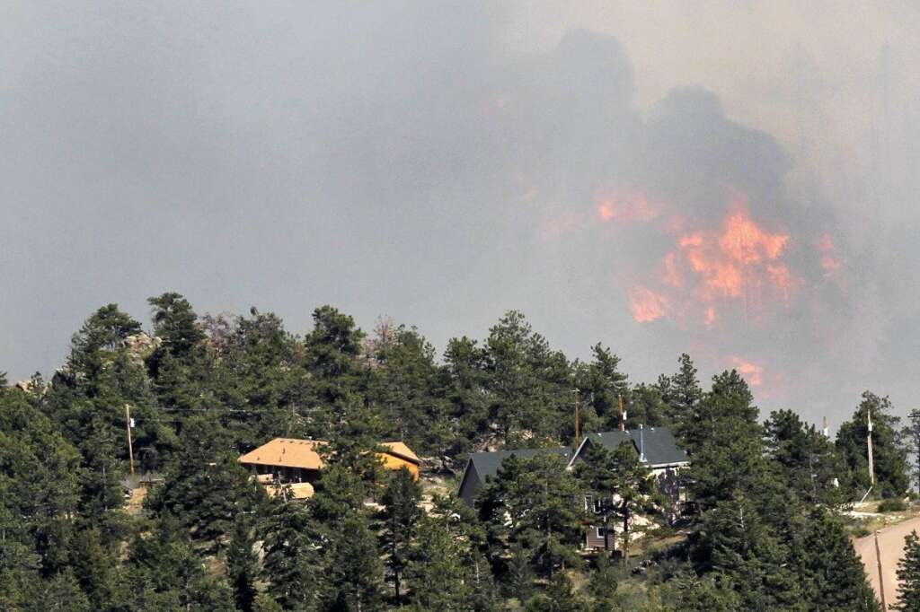 High Park Wildfire - Fire burns behind homes north of Poudre Canyon in the Glacier View area near Livermore, Colo., on Friday, June 22, 2012. The fire is burning on more than 68,000 acres west of Fort Collins and has destroyed at least 189 homes (AP Photo/Ed Andrieski)