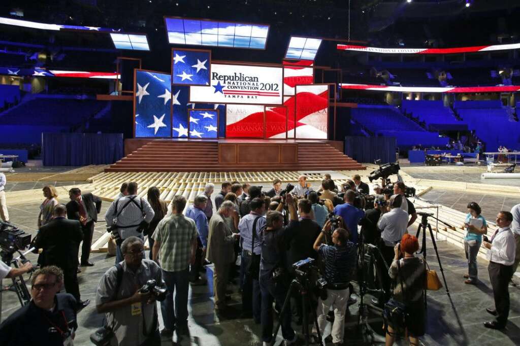 Members of the media conduct interviews on the floor after the unveiling of the stage and podium for the 2012 Republican National Convention, Monday, Aug. 20, 2012, at the Tampa Bay Times Forum in Tampa, Fla. (AP Photo/Scott Iskowitz)