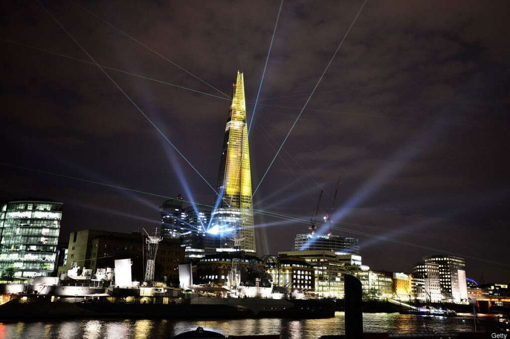 The Shard, Europe's Largest Building Is Unveiled After Completion Of It's Exterior - LONDON, ENGLAND - JULY 05:  The Shard is seen lit up during a laser light show from Tower Millennium Pier on July 5, 2012 in London, England. The European Union's highest building designed by Italian architect Renzo Piano, stands at 310 meters tall situated on London's Southbank is formally inaugurated this evening at 10pm with a laser show that will also be streamed live on the internet.  (Photo by Bethany Clarke/Getty Images)