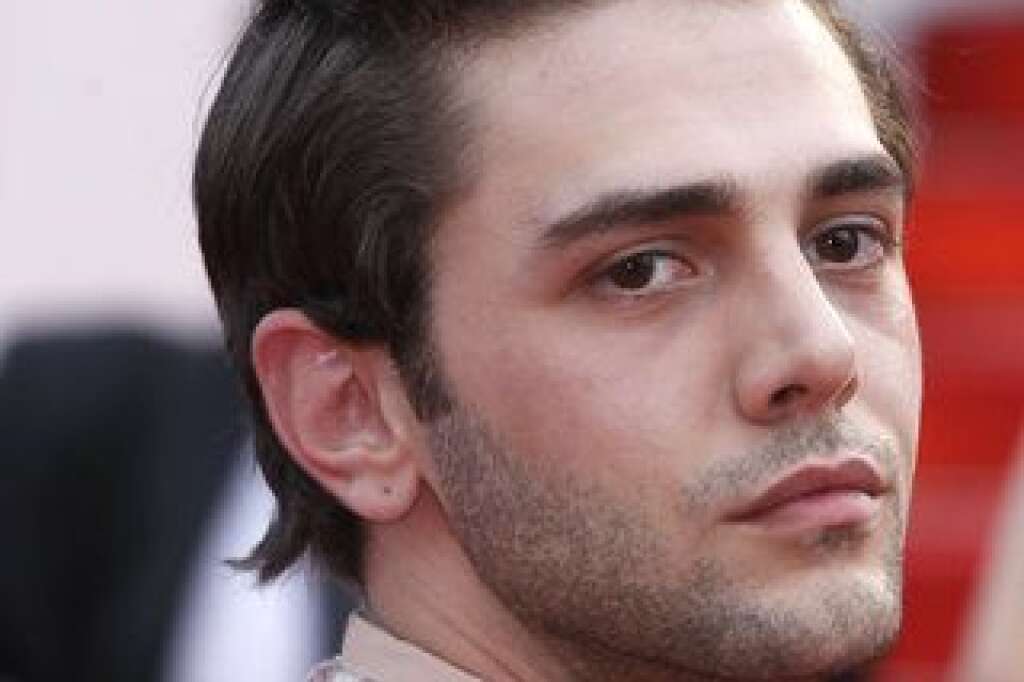 Le style coloré de Xavier Dolan - Xavier Dolan poses for photographers upon arrival for the screening of the film Macbeth at the 68th international film festival, Cannes, southern France, Saturday, May 23, 2015. (AP Photo/Lionel Cironneau)