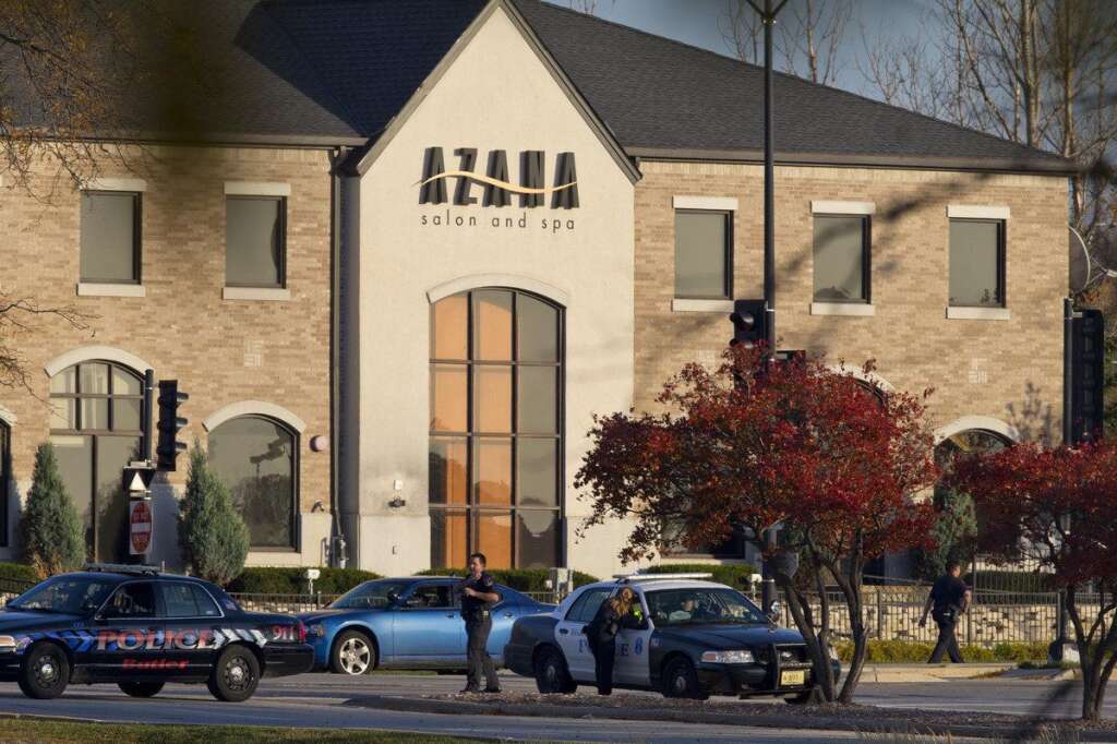 Three People Killed During Shooting At Spa Outside Of Milwaukee - BROOKFIELD, WI - OCTOBER 21:  Police personnel work outside the Azana Salon and Spa where three people were killed and four others wounded after a mass shooting on October 21, 2012 in Brookfield, Wisconsin. The suspected shooter, Radcliffe Haughton, was found dead inside the spa. (Photo by Jeffrey Phelps/Getty Images)