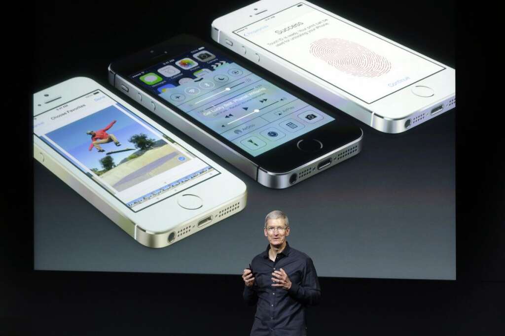 - Tim Cook, CEO of Apple, speaks on stage during the introduction of the new iPhone 5s in Cupertino, Calif., Tuesday, Sept. 10, 2013. (AP Photo/Marcio Jose Sanchez)