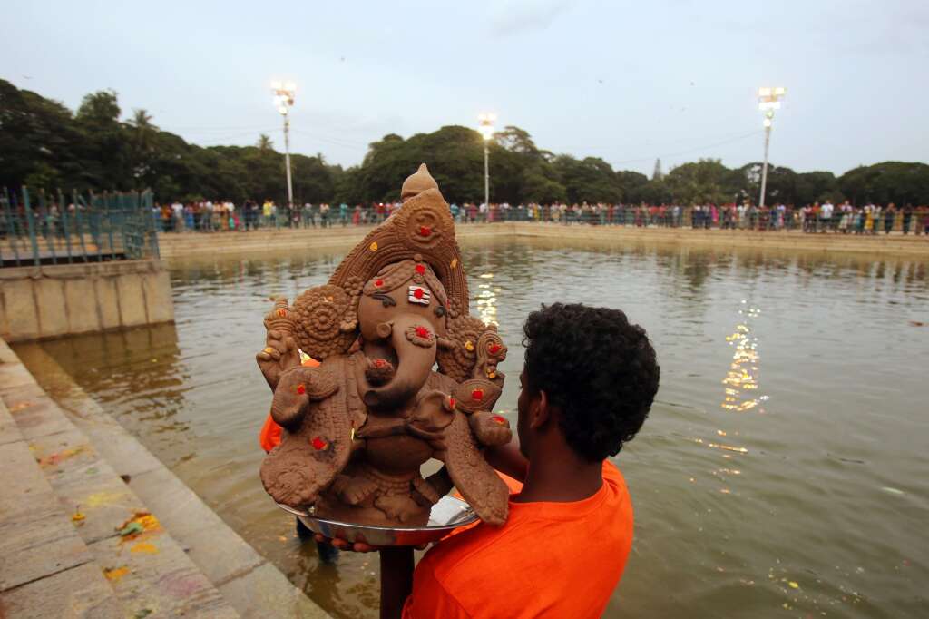 - A volunteer carries a clay made idol of elephant-headed Hindu god Ganesha for immersion in a pond during Ganesh Chaturthi festival celebrations in Bangalore, India, Monday, Sept. 5, 2016. The festival marks the birthday of Lord Ganesha who is widely worshiped by Hindus as the god of wisdom, prosperity and good fortune.