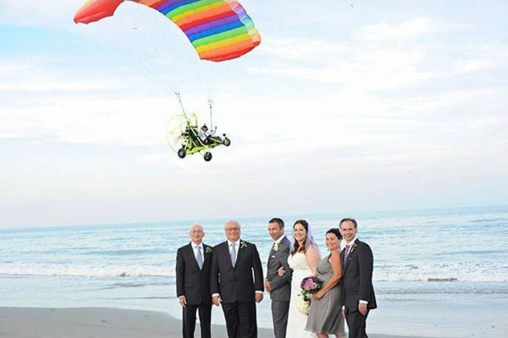 Bombs Away! - Wait, how do we land this thing again? Way to one-up the bride, thumbs-up rainbow parachute guy.  <span style="font-size:10px;"><em>Photo Credit: <a href="http://www.neilgt.com" target="_hplink">Neil GT Photography</a></em></span>