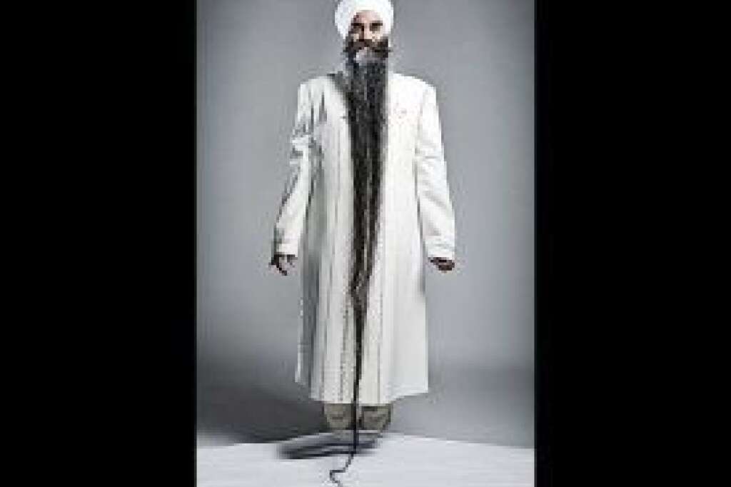 Sarwan Singh - Longest Beard - Sarwan Singh of Canada holds the record for longest beard: 7 feet, 9 inches.