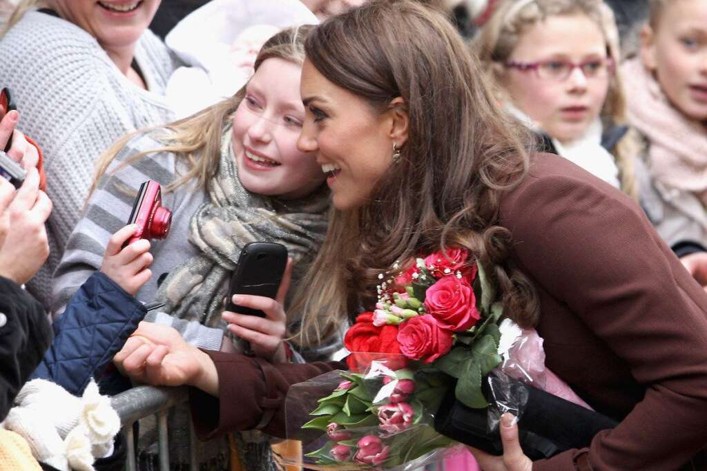The Duchess Of Cambridge Visits Liverpool - LIVERPOOL, ENGLAND - FEBRUARY 14:  Catherine, Duchess of Cambridge poses for photographs with young girls as she visits Alder Hey Children's NHS Foundation Trust on February 14, 2012 in Liverpool, England. The Duchess has spent the day in Liverpool and arrived at Alder Hey Hospital after a visit to 'The Brink'.  (Photo by Chris Jackson/Getty Images)