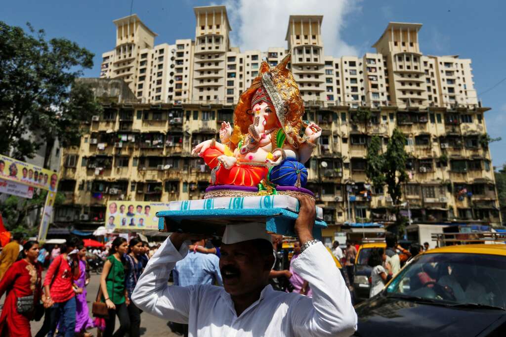 - A devotee carries an idol of the Hindu god Ganesh, the deity of prosperity, to a place of worship on the first day of the Ganesh Chaturthi festival in Mumbai, India, September 5, 2016.