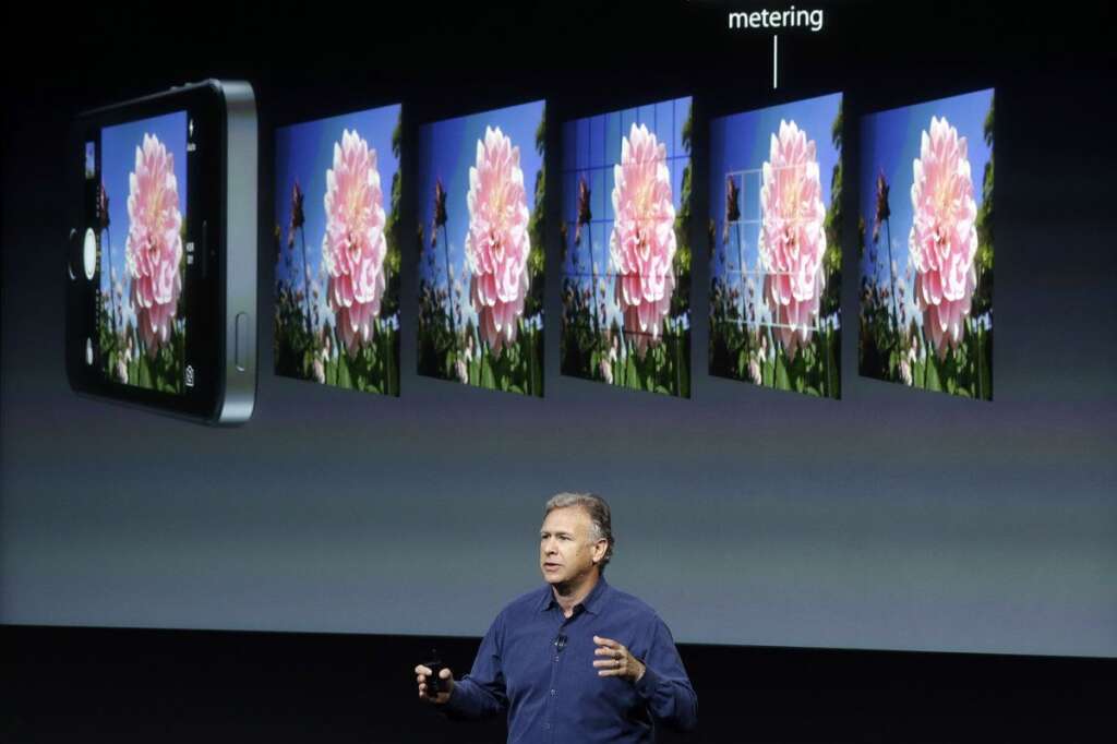 - Phil Schiller, Apple's senior vice president of worldwide product marketing, speaks on stage about the camera quality during the introduction of the new iPhone 5s in Cupertino, Calif., Tuesday, Sept. 10, 2013. (AP Photo/Marcio Jose Sanchez)