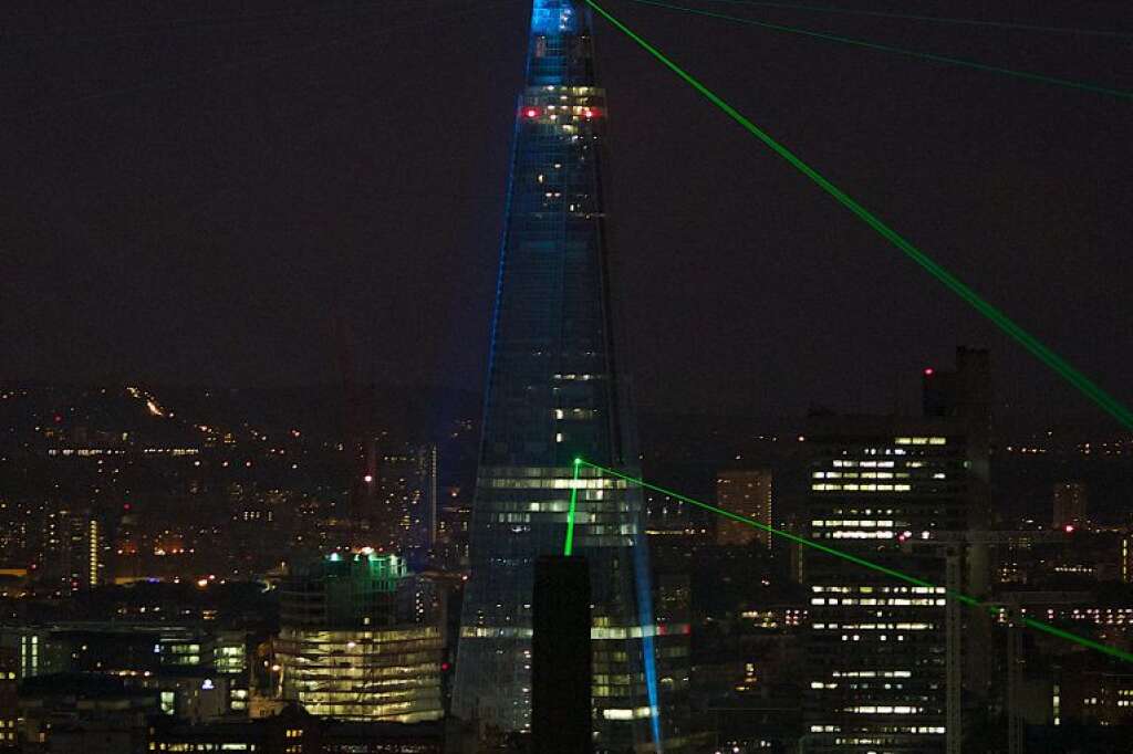 Lasers light up the  night sky from the - Lasers light up the  night sky from the Shard building during its inauguration in central London, on July 5, 2012. Europe's tallest skyscraper the Shard was inaugurated in a dazzling sound and light show befitting its status as the capital's brashest and most controversial building. The Shard's inauguration marks the completion of the exterior of the building, located on the south bank of the River Thames at London Bridge, while work on the inside is expected to continue into 2013. AFP PHOTO/ANDREW COWIE        (Photo credit should read Andrew Cowie/AFP/GettyImages)