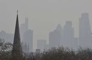 The UK's poorest communities are being hit the hardest by air pollution; London's financial district is seen above, obscured by air pollution