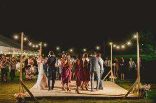 Play your first dance song and invite guests to come up and dance alongside you.