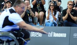 Prince Harry and Meghan Markle applaud as they watch Wheelchair Tennis at the 2017 Invictus Games in Toronto, Canada.