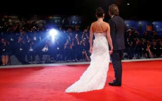 Actors Penelope Cruz and Javier Bardem pose during a red carpet event for the movie 