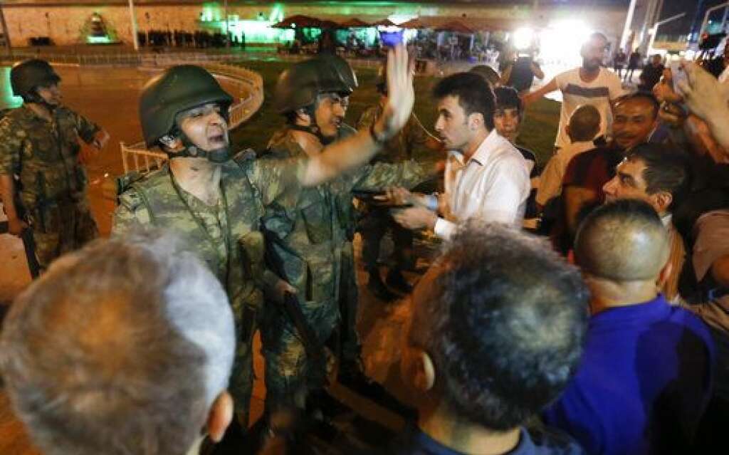 Turkish military discuss with people at the Taksim Square in Istanbul, Turkey, July 16, 2016. REUTERS/Murad Sezer